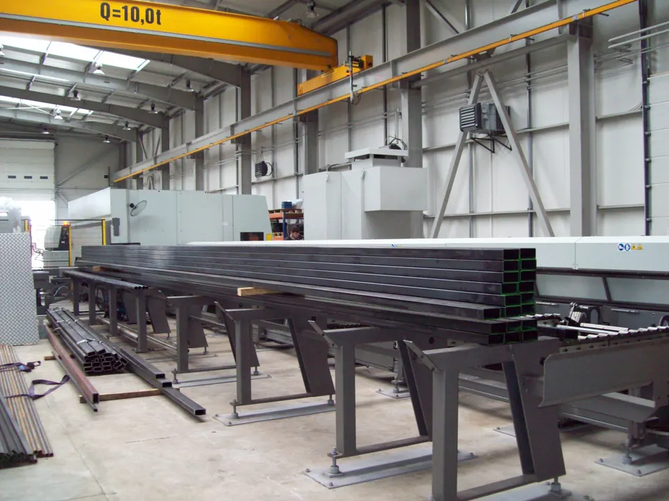 Hall with overhead crane and welded structures on stands