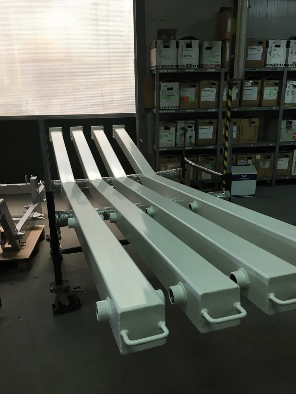 Welded hollow-section parts, powder-coated white