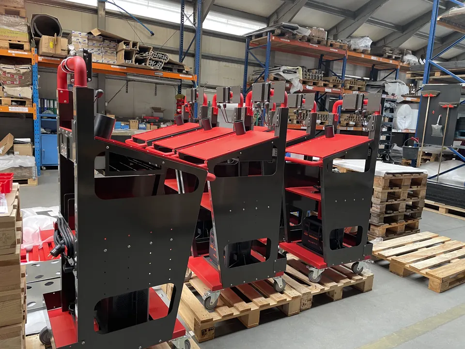 Welded logistics trolleys painted red and black