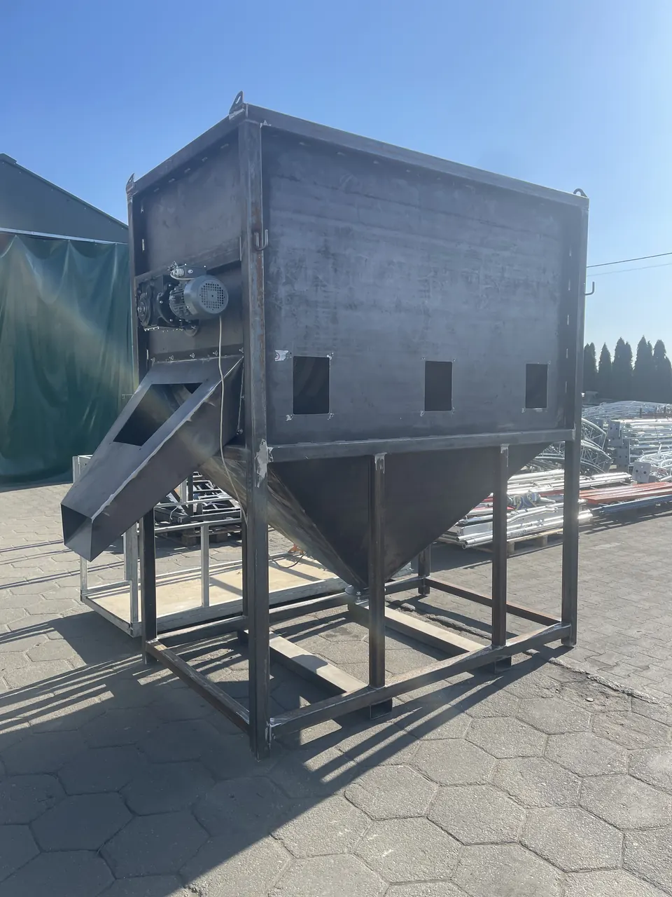 Welded sheet-metal chute on a stand