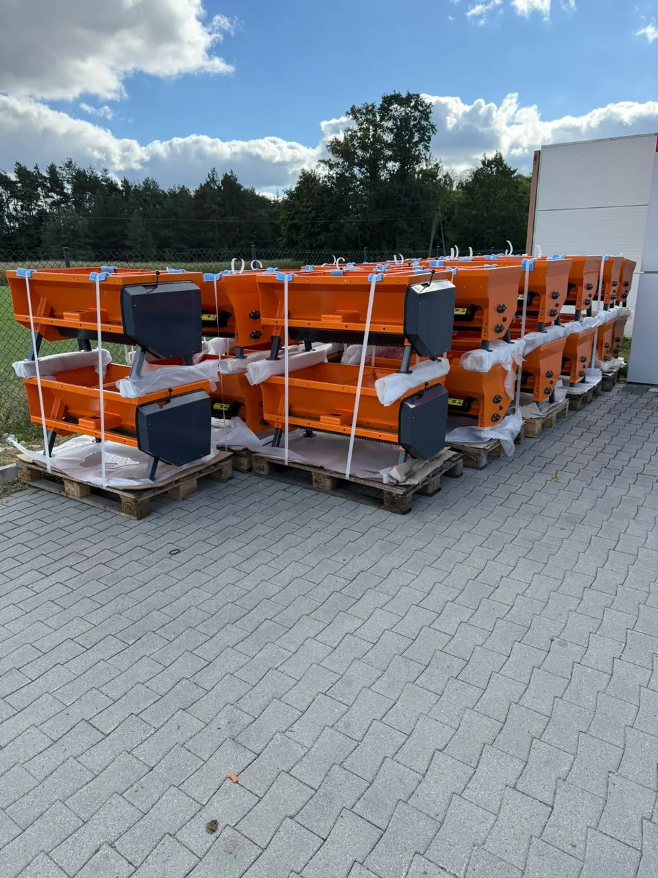 Orange hoppers packed on pallets